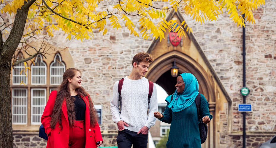 Three students in conversation outside St Luke's Campus